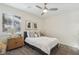 Cozy bedroom featuring a double bed and window with plantation shutters at 9802 Summer Bliss Ave, Las Vegas, NV 89149