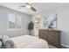 Spacious bedroom with ensuite bathroom access and a dresser at 9802 Summer Bliss Ave, Las Vegas, NV 89149