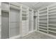 Large walk-in closet with custom shelving and hanging rods at 9802 Summer Bliss Ave, Las Vegas, NV 89149