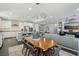 Open concept dining area with kitchen and living room views at 9802 Summer Bliss Ave, Las Vegas, NV 89149