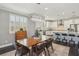 Bright dining room with mid-century modern furniture at 9802 Summer Bliss Ave, Las Vegas, NV 89149