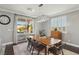 Dining area with wooden table and access to backyard at 9802 Summer Bliss Ave, Las Vegas, NV 89149