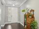 Bright entryway with hardwood floors and antique secretary at 9802 Summer Bliss Ave, Las Vegas, NV 89149