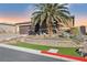 One-story house with a landscaped yard and palm tree at 9802 Summer Bliss Ave, Las Vegas, NV 89149