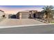 Beautiful home exterior with a large driveway at 9802 Summer Bliss Ave, Las Vegas, NV 89149