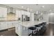 Modern kitchen with white cabinetry and a large center island at 9802 Summer Bliss Ave, Las Vegas, NV 89149