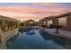 Inviting pool and spa with a tranquil waterfall backdrop at 9802 Summer Bliss Ave, Las Vegas, NV 89149