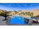 Inviting pool and spa with a tranquil waterfall backdrop at 9802 Summer Bliss Ave, Las Vegas, NV 89149