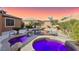 Relaxing backyard oasis featuring a sparkling pool, spa, and waterfall feature at 9802 Summer Bliss Ave, Las Vegas, NV 89149