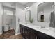 Modern bathroom with double vanity, shiplap feature wall, and walk-in shower at 9820 Maiden Pink Ave, Las Vegas, NV 89149