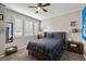 Bedroom with a double bed, window shutters, and wood dresser at 9820 Maiden Pink Ave, Las Vegas, NV 89149