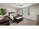 Bedroom with wooden frame bed, carpeted floor, and window coverings at 9820 Maiden Pink Ave, Las Vegas, NV 89149