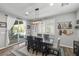 Bright dining room with wooden table and backyard access at 9820 Maiden Pink Ave, Las Vegas, NV 89149