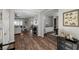 Bright and spacious entryway with wood-look flooring, leading to the living room at 9820 Maiden Pink Ave, Las Vegas, NV 89149