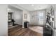 Entryway with wood-look floors, built-in shelving, and home office at 9820 Maiden Pink Ave, Las Vegas, NV 89149