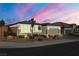 Beautiful single-story home with landscaped front yard and two-car garage at 9820 Maiden Pink Ave, Las Vegas, NV 89149