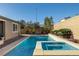 Relaxing pool and spa with brick patio at 9820 Maiden Pink Ave, Las Vegas, NV 89149