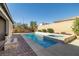 Spacious pool and spa with patio and fire pit at 9820 Maiden Pink Ave, Las Vegas, NV 89149