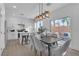 Open concept dining area with kitchen views and sliding door access to backyard at 10852 Avenzano St, Las Vegas, NV 89141