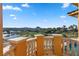 Picturesque balcony view overlooking a pool, lush landscaping, and distant mountains at 17 Rue Du Rivoli Pl, Henderson, NV 89011