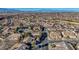 Aerial view of a residential community nestled in a desert landscape with mountain views at 2039 Colvin Run Dr, Henderson, NV 89052