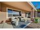 Spacious backyard patio with seating area and desert landscape at 2039 Colvin Run Dr, Henderson, NV 89052