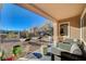 Covered patio with seating area, offering mountain views at 2039 Colvin Run Dr, Henderson, NV 89052