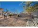 Relaxing backyard oasis with gravel and metal bench at 2039 Colvin Run Dr, Henderson, NV 89052