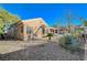 Backyard view showcasing desert landscaping and giraffe statues at 2039 Colvin Run Dr, Henderson, NV 89052