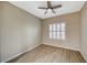 Light-filled bedroom with ceiling fan and wood-look flooring at 2039 Colvin Run Dr, Henderson, NV 89052