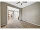 Spacious bedroom with wood-look flooring and access to hallway at 2039 Colvin Run Dr, Henderson, NV 89052
