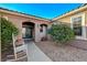 Charming courtyard entry with rocking chairs and potted plants at 2039 Colvin Run Dr, Henderson, NV 89052