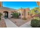 Front courtyard entry with gravel and a rocking chair at 2039 Colvin Run Dr, Henderson, NV 89052