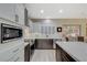 Modern kitchen featuring stainless steel appliances and dark wood cabinetry at 2039 Colvin Run Dr, Henderson, NV 89052