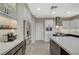 Bright kitchen with stainless steel appliances and white cabinetry at 2039 Colvin Run Dr, Henderson, NV 89052