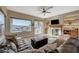 Relaxing living room with a fireplace and large windows at 2039 Colvin Run Dr, Henderson, NV 89052