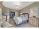 Spacious main bedroom with ceiling fan and ensuite bathroom at 2039 Colvin Run Dr, Henderson, NV 89052