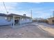 Backyard view showing a covered patio and large, open space at 213 Valley Forge Ave, Henderson, NV 89015