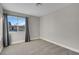 Spacious bedroom featuring a window with gray curtains at 213 Valley Forge Ave, Henderson, NV 89015