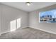 Well-lit bedroom with carpet and window view at 213 Valley Forge Ave, Henderson, NV 89015