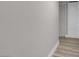 Simple hallway with light walls and wood floors at 213 Valley Forge Ave, Henderson, NV 89015