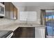 Modern kitchen with granite countertops and stainless steel appliances at 213 Valley Forge Ave, Henderson, NV 89015