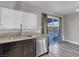 Kitchen with stainless steel dishwasher and backyard access at 213 Valley Forge Ave, Henderson, NV 89015