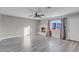 Bright living room with fireplace, hardwood floors, and ceiling fan at 213 Valley Forge Ave, Henderson, NV 89015
