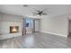 Living room featuring a fireplace and gray laminate flooring at 213 Valley Forge Ave, Henderson, NV 89015