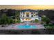 Luxury home with pool and waterfall feature at sunset at 22 Anthem Pointe Ct, Henderson, NV 89052