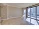 Living room featuring tile floors and access to balcony with city views at 222 Karen Ave # 1604, Las Vegas, NV 89109
