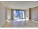 Bright living room featuring tile floors and access to a balcony with city views at 222 Karen Ave # 1604, Las Vegas, NV 89109