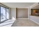 Sunlit living room showcasing tile floors and access to a private balcony at 222 Karen Ave # 1604, Las Vegas, NV 89109