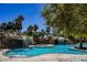 Inviting resort-style pool with waterfalls and grotto at 222 Karen Ave # 1604, Las Vegas, NV 89109